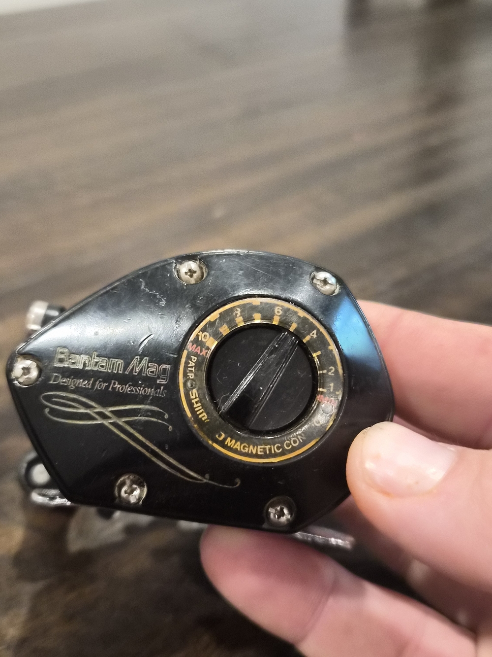 Shimano Bantam Mag Left-Hand Baitcasting Reel in Black and Gold